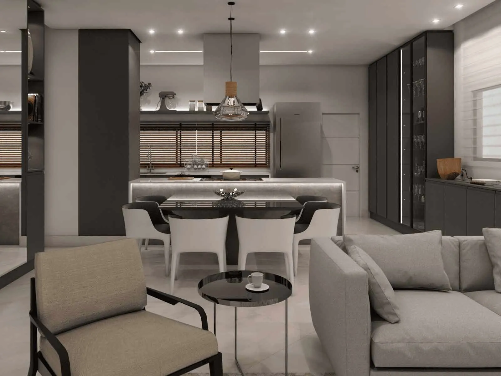 Cozinha cinza integrada à sala com sofá e mesa de jantar